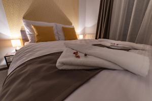 A bed or beds in a room at Penzión pod brezami**