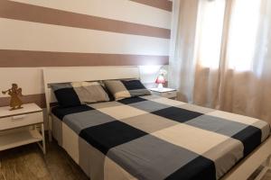 Postel nebo postele na pokoji v ubytování Appartamento Camisa