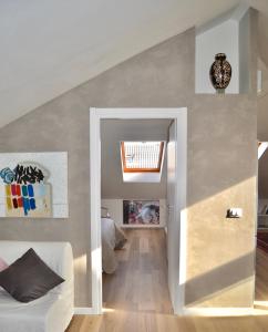 a hallway leading to a bedroom with a ceiling at SkyEscaPe Pescara Centro in Pescara