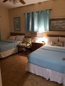 Postel nebo postele na pokoji v ubytování Midtown Guest House