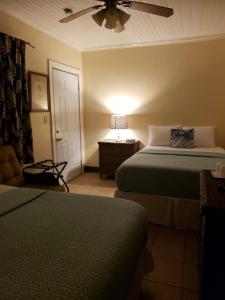Postel nebo postele na pokoji v ubytování Midtown Guest House