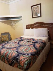 Postel nebo postele na pokoji v ubytování Midtown Guest House
