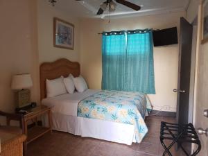 Postel nebo postele na pokoji v ubytování Midtown Guest House