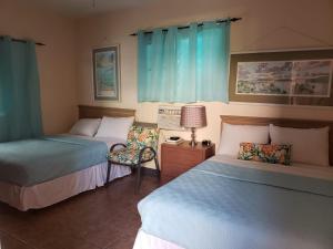 Postel nebo postele na pokoji v ubytování Midtown Guest House