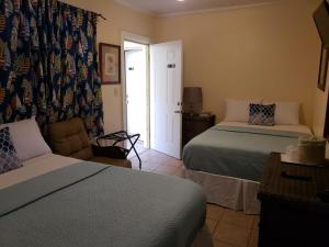Postel nebo postele na pokoji v ubytování Midtown Guest House