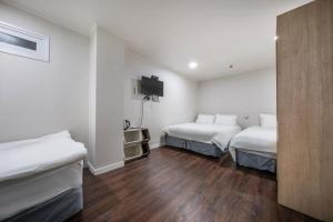 Postel nebo postele na pokoji v ubytování MAYONE HOTEL Myeongdong