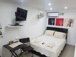 Postel nebo postele na pokoji v ubytování Posada J&J Forbes - 1