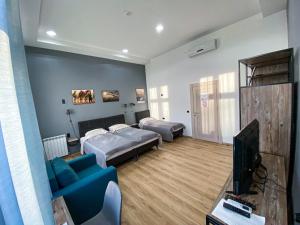 TV a/nebo společenská místnost v ubytování K43 Rooms + 24 fotografií