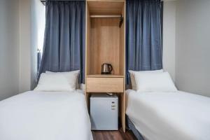 Säng eller sängar i ett rum på MAYONE HOTEL Myeongdong