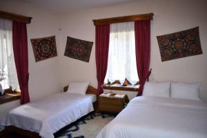 Postel nebo postele na pokoji v ubytování Eufrosini Guesthouse
