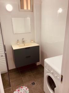 a bathroom with a sink and a washing machine at BEAUTIFUL PRIVATE in Beer Sheva