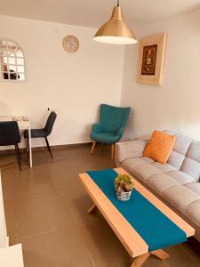 a living room with a couch and a table at BEAUTIFUL PRIVATE in Beer Sheva