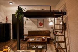a living room with a couch and a loft bed at “Forte 99” in Venice in Mestre +35 photos