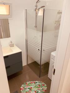 a bathroom with a shower and a washing machine at BEST BEAUTIFUL PRIVATE in Beer Sheva