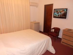Voodi või voodid majutusasutuse Tanger Hotel toas