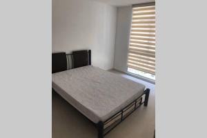 Postel nebo postele na pokoji v ubytování Apartamento cómodo con todo lo que necesitas con Aire Acondicionado !! + 14 fotografií