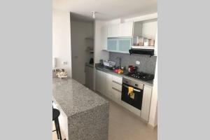 Kuchyň nebo kuchyňský kout v ubytování Apartamento cómodo con todo lo que necesitas con Aire Acondicionado !!