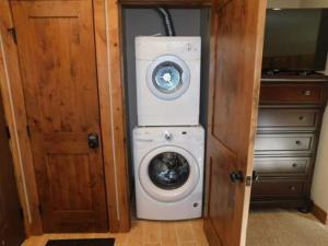 a washer and dryer in a small room at Breakaway West Studio Condo in Vail