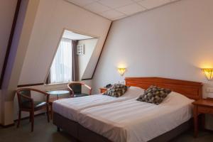 Säng eller sängar i ett rum på Best Western Hotel Baars