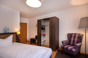 Postel nebo postele na pokoji v ubytování Posthotel Kolberbräu