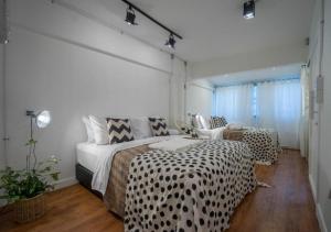 Postel nebo postele na pokoji v ubytování 3Bedrooms City Nimman
