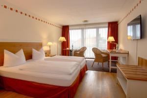 Postel nebo postele na pokoji v ubytování Posthotel Kolberbräu