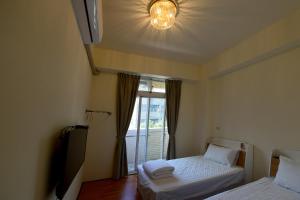 Voodi või voodid majutusasutuse Light Time Homestay toas