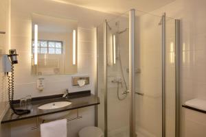 Koupelna v ubytování Posthotel Kolberbräu