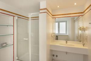 Koupelna v ubytování Posthotel Kolberbräu