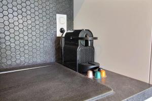 a coffee machine sitting on a counter in a kitchen at Residence ACQUA LINDA Porticcio in Porticcio