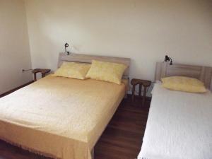 Postel nebo postele na pokoji v ubytování Apartmani Juliška