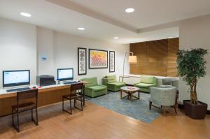 a waiting room with chairs and a desk with a computer at Holiday Inn Express - Times Square, an IHG Hotel in New York
