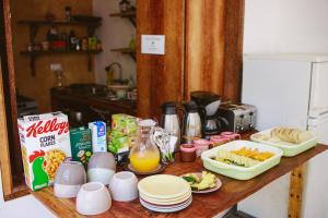 a table with breakfast foods and drinks on it at Siri Beach Lodge in Nungwi