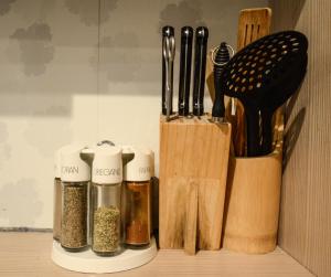 a group of knives and utensils on a shelf at 2 · High-Quality in the heart of Stuttgart 2 in Stuttgart
