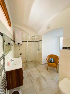 a bathroom with a sink and a shower at Schloss Krottenhof in Langenwang