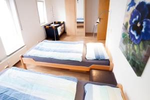 Llit o llits en una habitació de FewoLeipzig Süd mit Tiefgarage