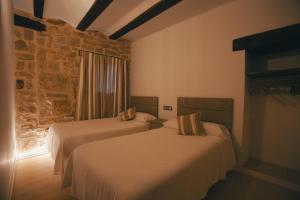 Postel nebo postele na pokoji v ubytování El Racó de Valderrobres