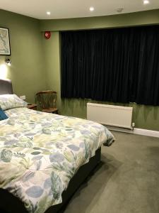 A bed or beds in a room at Dairy Guest House 