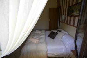 A bed or beds in a room at Fonte Di Bagnaria