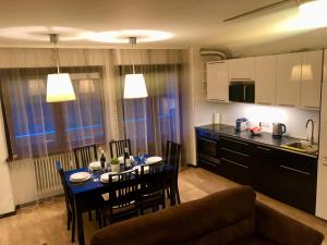 Kuchyňa alebo kuchynka v ubytovaní Localita Polin 15, apartamenti 21