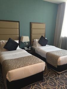 Voodi või voodid majutusasutuse Ramada Abu Dhabi Corniche toas
