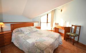 Llit o llits en una habitació de Apartamentos Castru Gaiteru