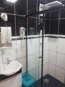 Ett badrum på Flat Hotel Cavalinho Branco