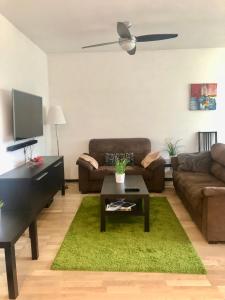 a living room with a couch and a table at Localita Polin 15, apartamenti 21 in Tione di Trento