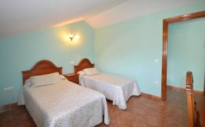 Ein Bett oder Betten in einem Zimmer der Unterkunft Apartamentos Castru Gaiteru