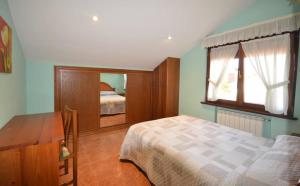 Ein Bett oder Betten in einem Zimmer der Unterkunft Apartamentos Castru Gaiteru