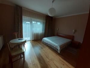 Postel nebo postele na pokoji v ubytování Hutasori Guesthouse