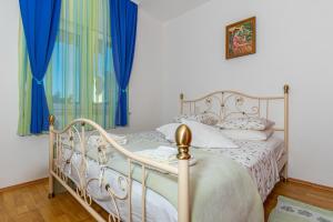 Postel nebo postele na pokoji v ubytování Apartman Dadi