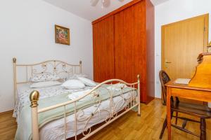 Postel nebo postele na pokoji v ubytování Apartman Dadi