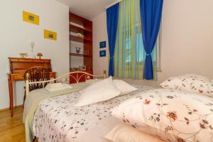 Postel nebo postele na pokoji v ubytování Apartman Dadi